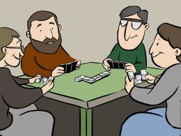 Grupo de jubilados jugando al dominó